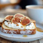 Ricotta toast with figs and honey, served with espresso on a wooden table.
