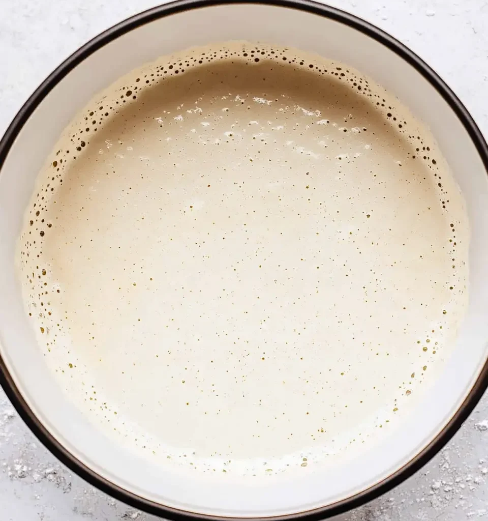 The Best Pancake Muffin Recipe: Easy, Fluffy, and Delicious 12 The pancake muffin batter is fully mixed, with a smooth and airy texture, ready for pouring into muffin tins.