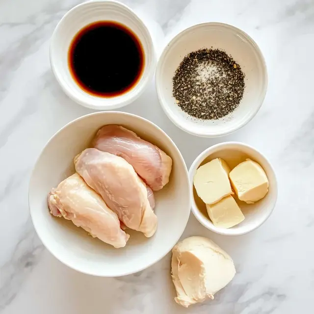 The Best Blackstone Chicken Recipes You’ll Ever Try 8 Raw chicken wings with seasoning ingredients, butter, and soy sauce in small bowls.